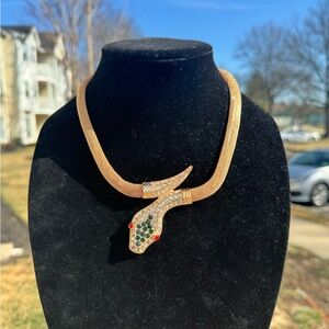Elegant Gold Snake Necklace with Green and Red Accents